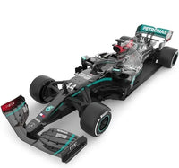 Formula 1 car with Petronas branding on a white background
