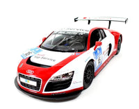 Model of a red and white Audi race car on a white background