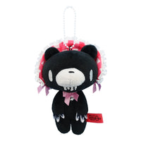 Black plush toy with red and white accents on a white background