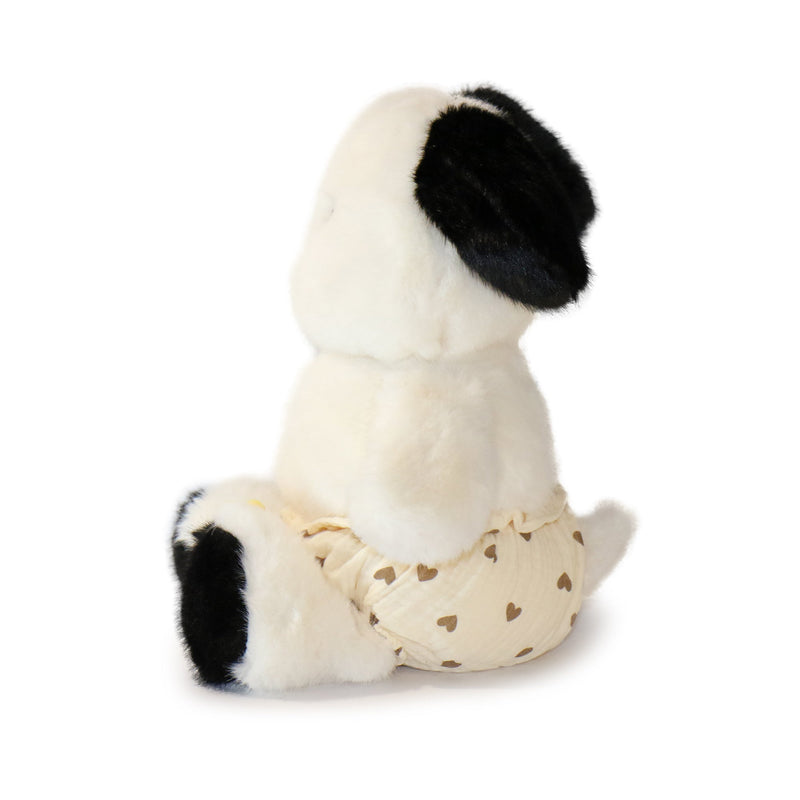 White plush toy with black spots on a white background