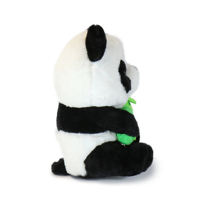 Plush panda toy holding a green leaf on a white background