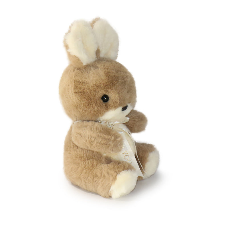 Plush toy deer with a white bow on a white background
