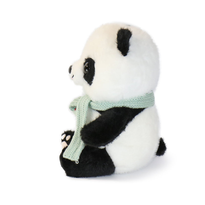 Plush panda toy with a green scarf on a white background