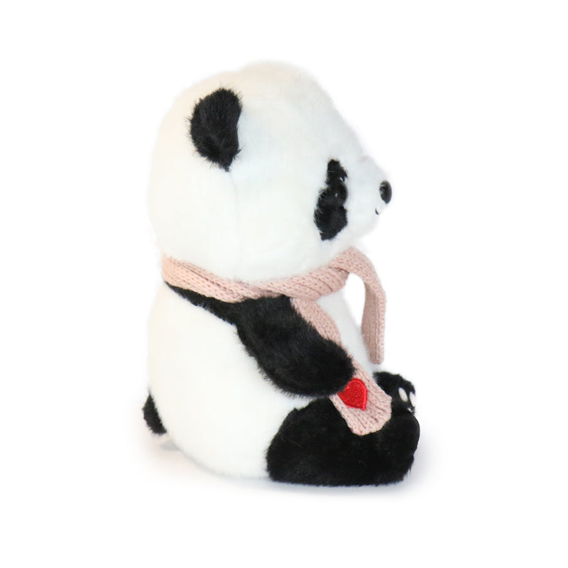 Plush panda toy wearing a pink scarf on a white background