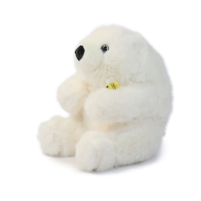 Plush polar bear toy on a white background
