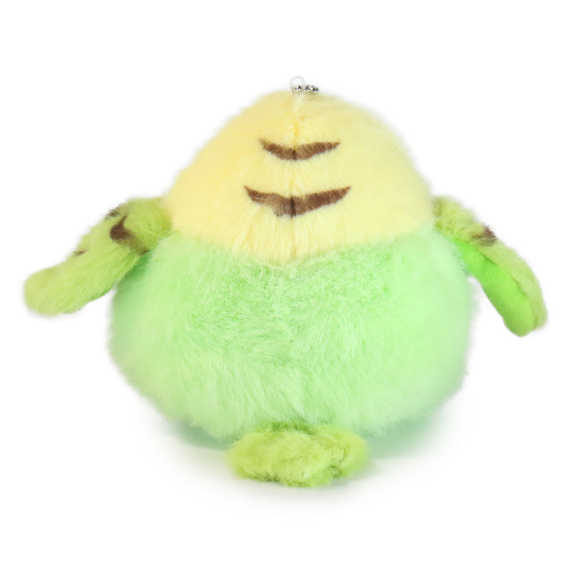 Plush toy resembling a green creature with a yellow face on a white background