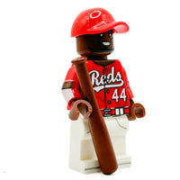 Baseball player minifigure in red and white uniform with bat on white background