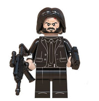Action figure with a suit and weapons on a white background