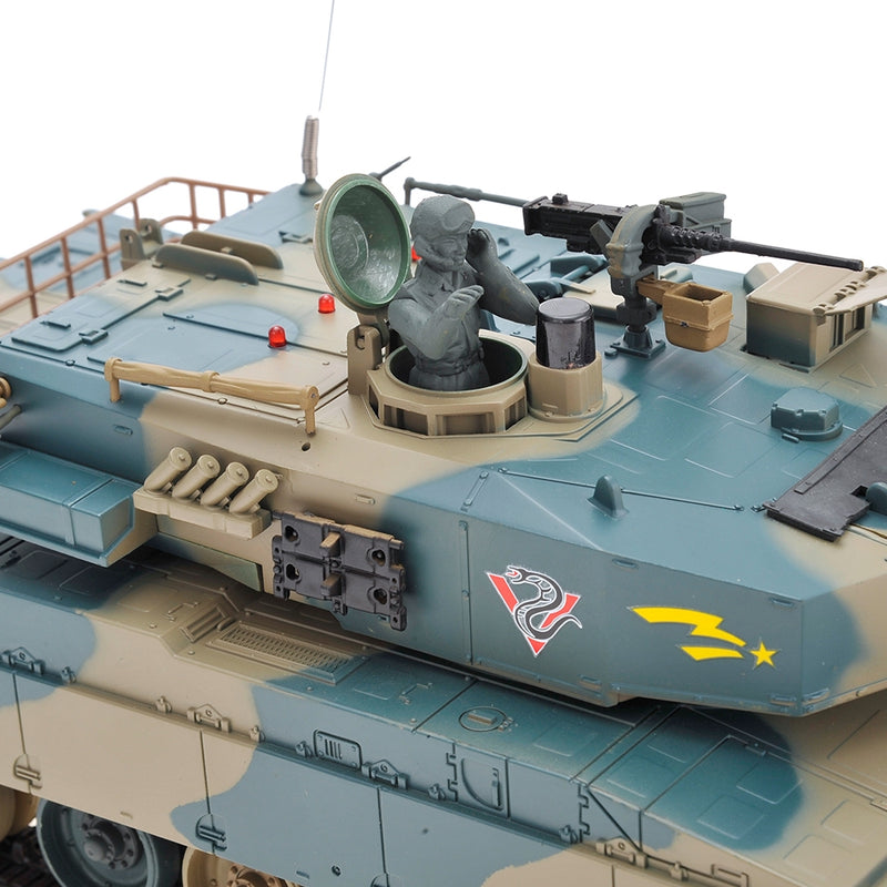 Model tank with detailed components and camouflage pattern on a white background