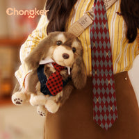 Stuffed dog toy with a tie held by a person wearing a yellow shirt and brown pants, with 'Chongker' branding.