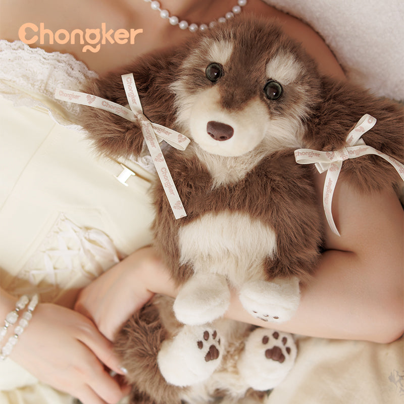 Brown teddy bear with white paws held by a person wearing pearls, with 'Chongker' branding.