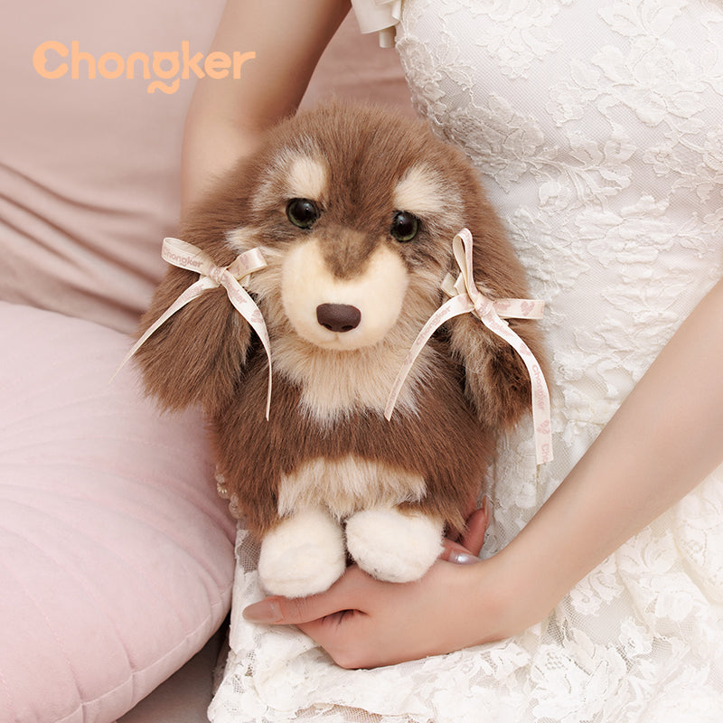 Stuffed dog toy with ribbons held by a person in a white dress, brand 'Chongker' visible.