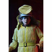 Person wearing a bright yellow space suit with a helmet against a dark background