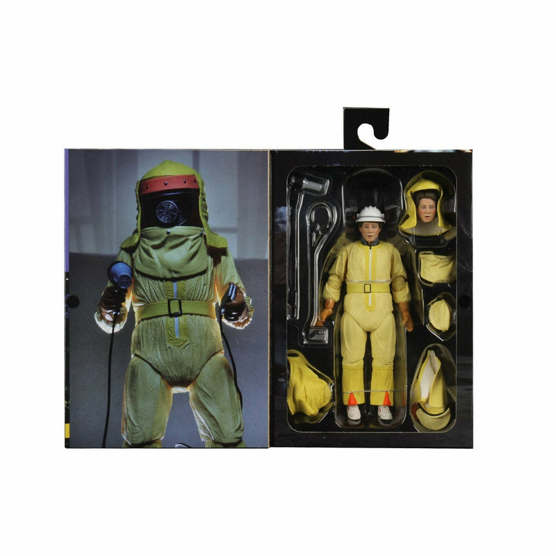 Two action figures in protective suits, one green and one beige, with packaging showing additional figures.