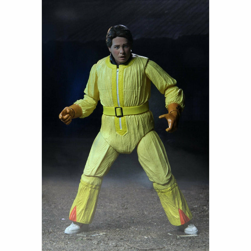 Action figure in a yellow outfit with a dark background