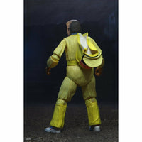 Action figure in a yellow suit with a backpack on a dark background