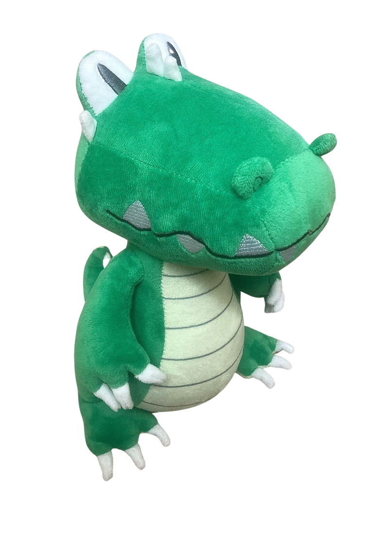 Green plush toy with white accents on a white background