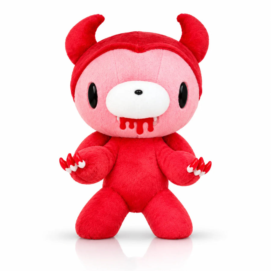 Red plush toy with horns on a white background