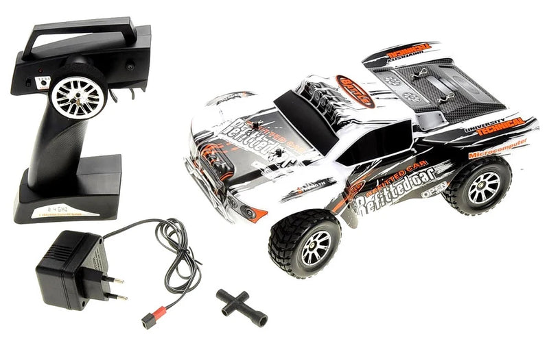 RC car with remote control, power adapter, and cable on a white background