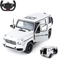 White toy SUV with open doors and a remote control on a white background