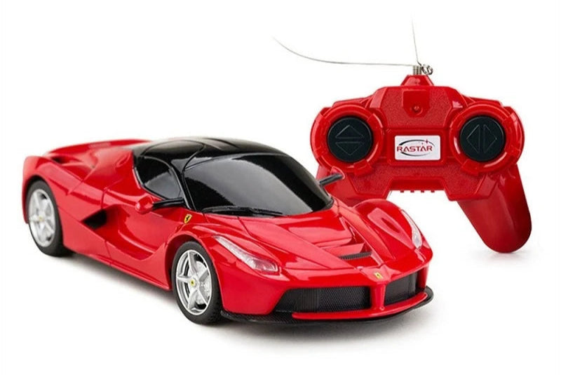 Red toy car with remote control on a white background