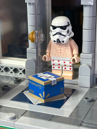 LEGO stormtrooper minifigure with a box labeled 'Brickmart' on a gray platform.