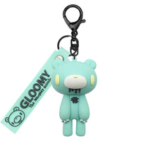 Gloomy Bear keychain with a tag on a white background