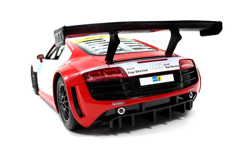Red Audi car with a large rear wing on a white background