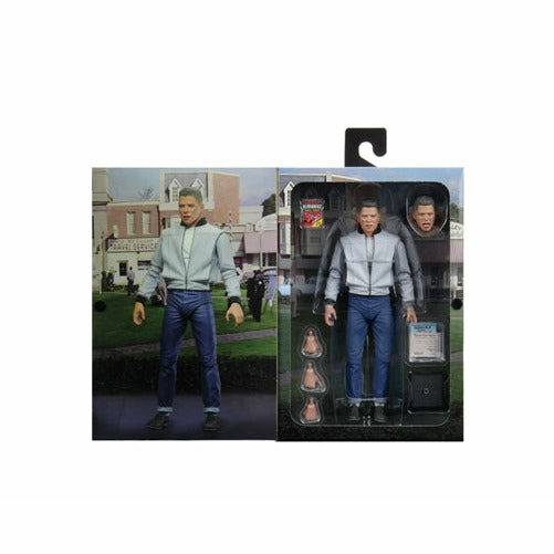 Action figure with packaging displaying a cityscape background
