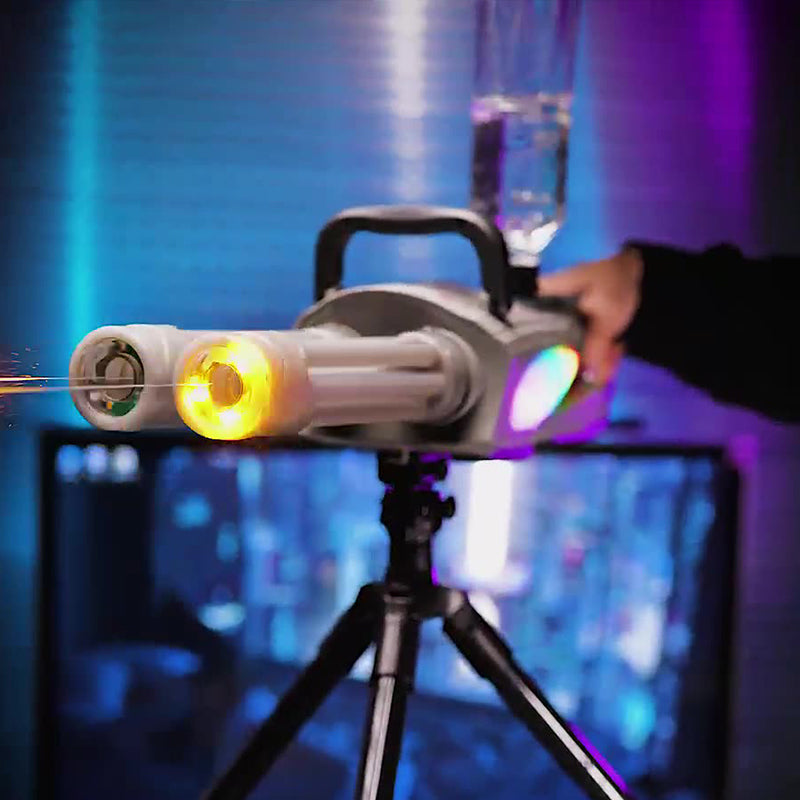 Lasershow projector on a tripod with colorful lights in the background