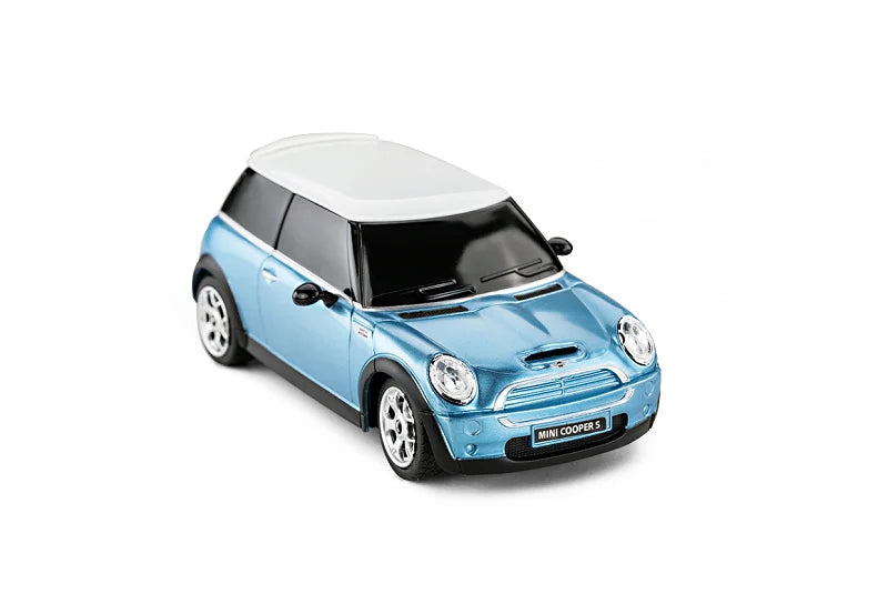 Blue Mini Cooper model car on a white background