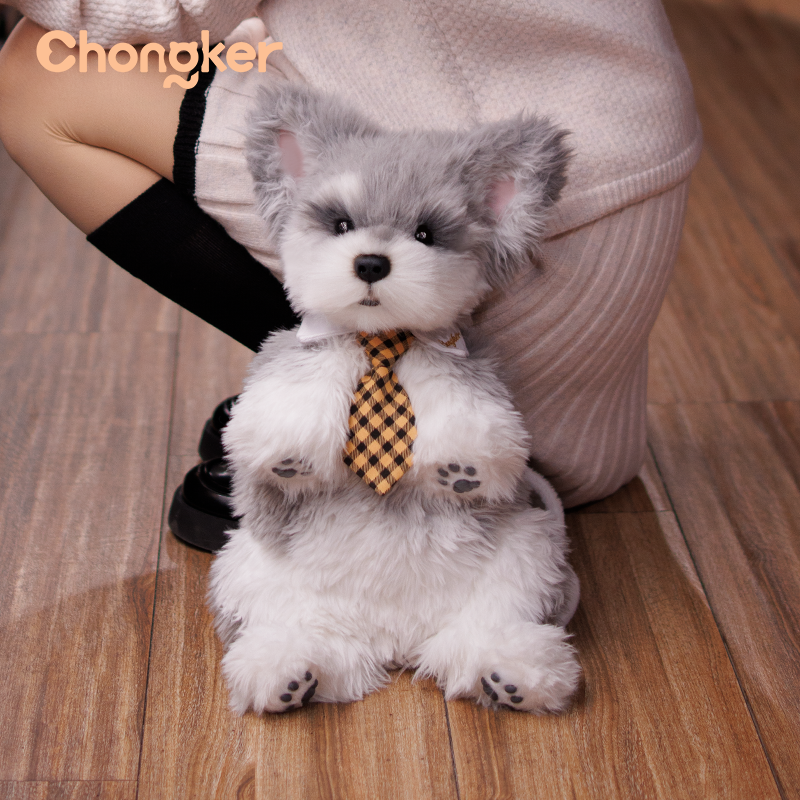 Plush toy dog with a checkered tie on a wooden floor, brand 'Chongker' visible
