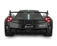 Back view of a black Pagani Huayra BC sports car on a white background