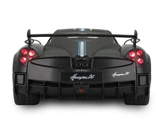 Back view of a black Pagani Huayra BC sports car on a white background