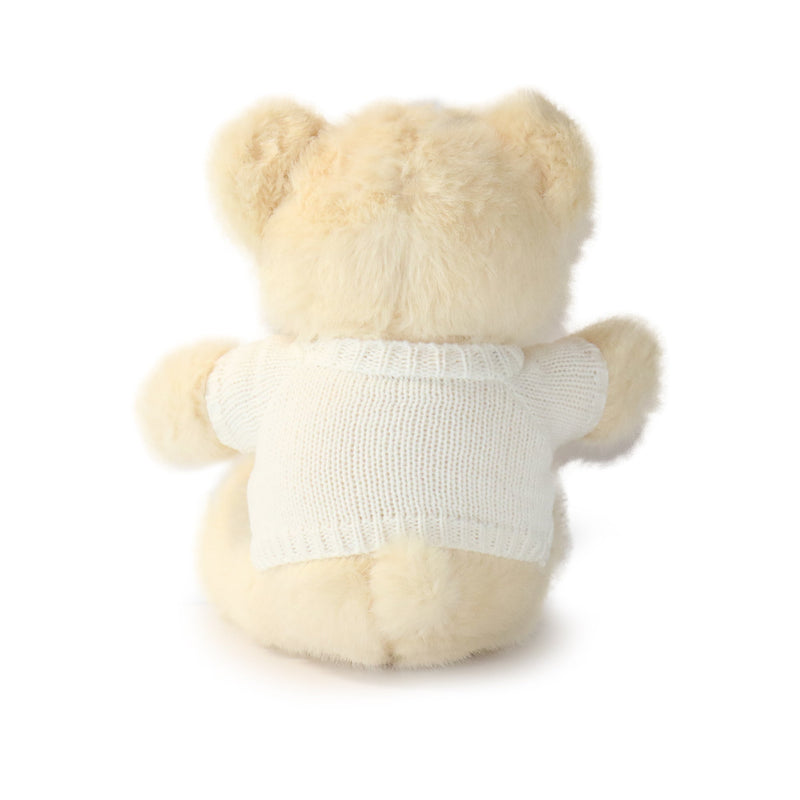 Plush teddy bear wearing a white shirt on a white background