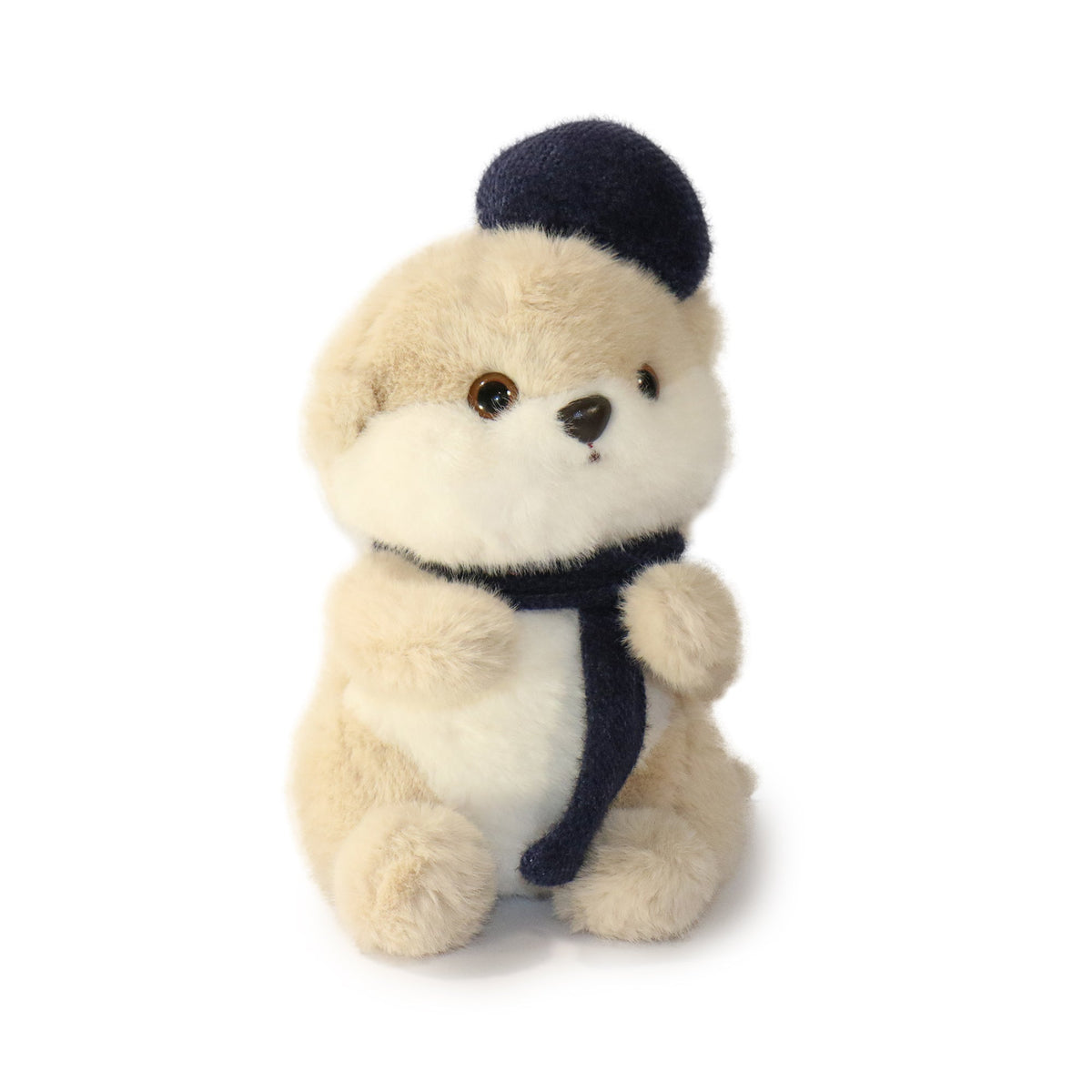 Stuffed animal toy with a navy hat and scarf on a white background