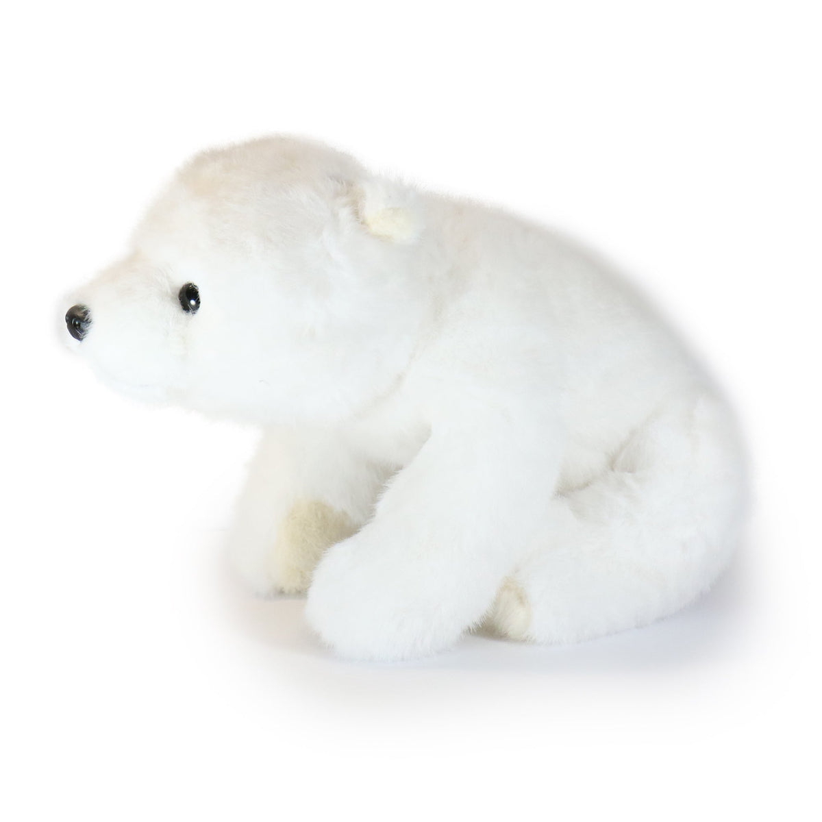 White plush polar bear toy on a white background