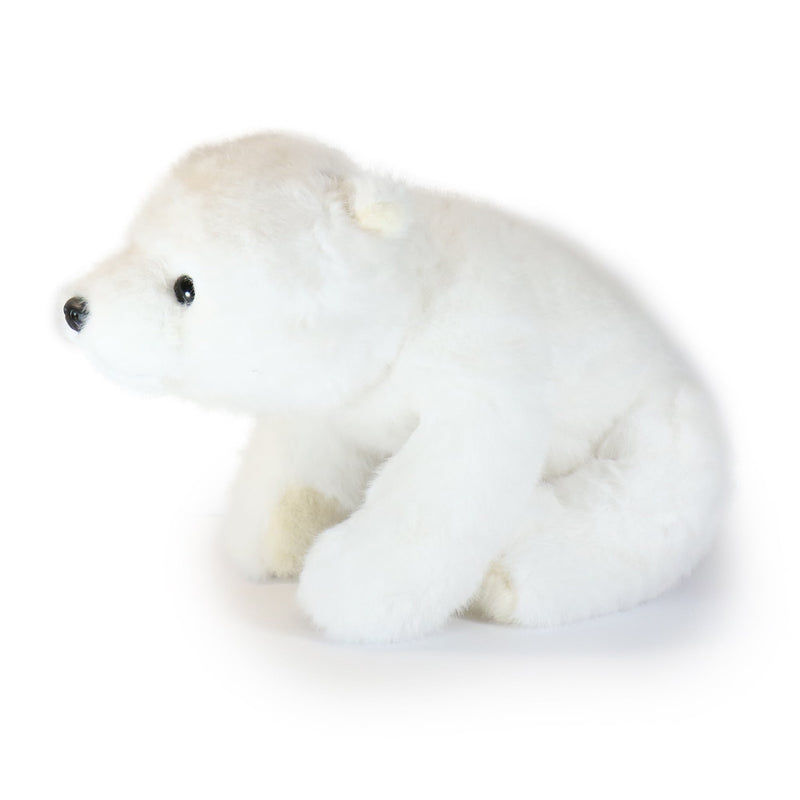 White plush polar bear toy on a white background