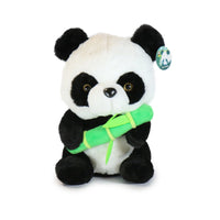 Plush panda toy holding a bamboo stick on a white background