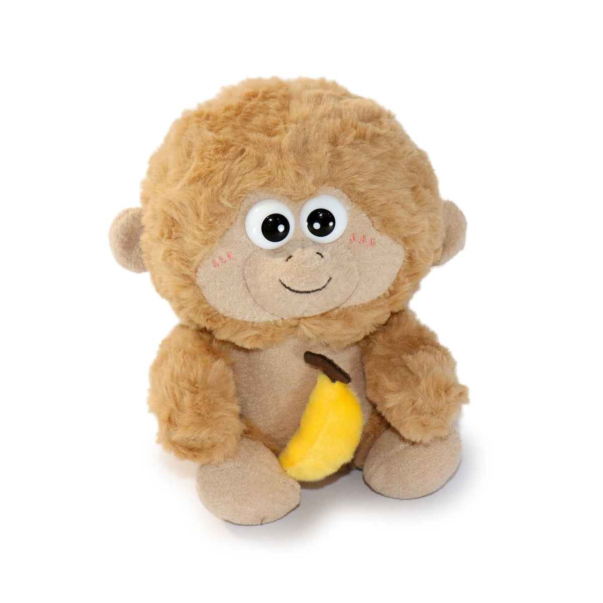 Plush monkey toy holding a banana on a white background