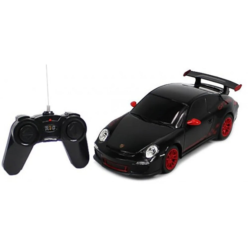 Black toy car with red accents and a remote control on a white background