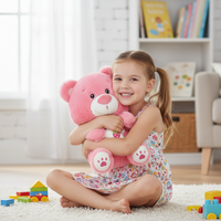 Young girl holding a pink teddy bear in a room with toys and a bookshelf.