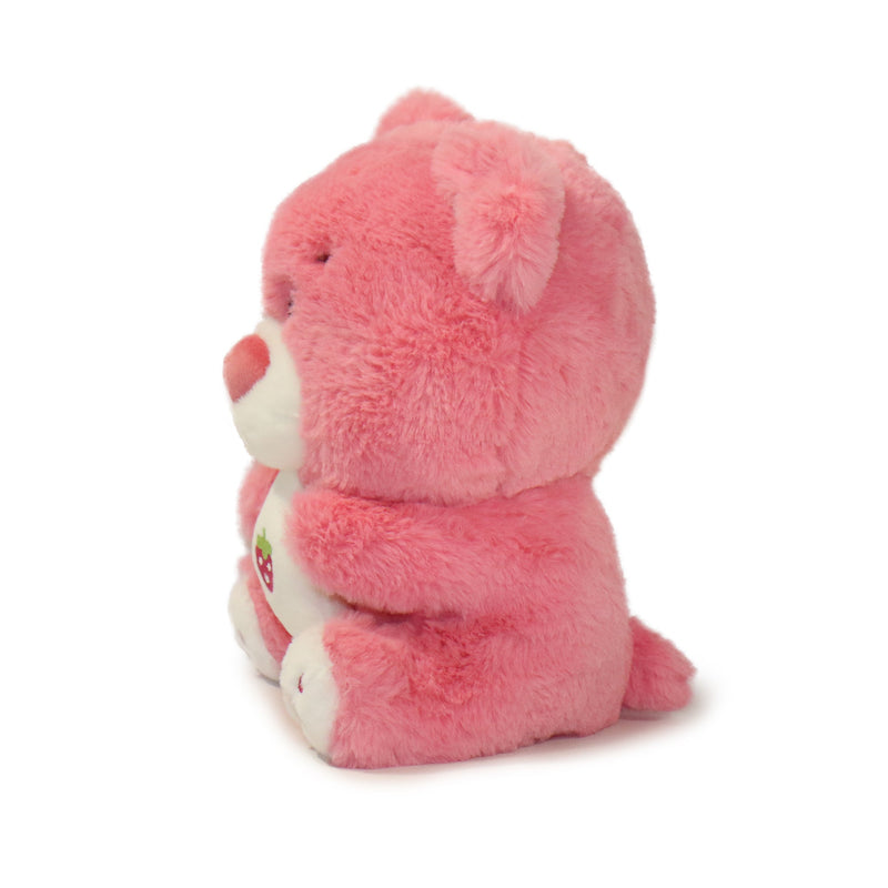 Pink plush bear toy on a white background