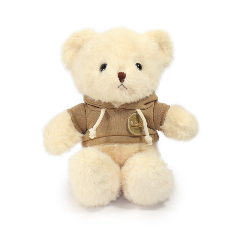 Beige teddy bear wearing a brown hoodie on a white background