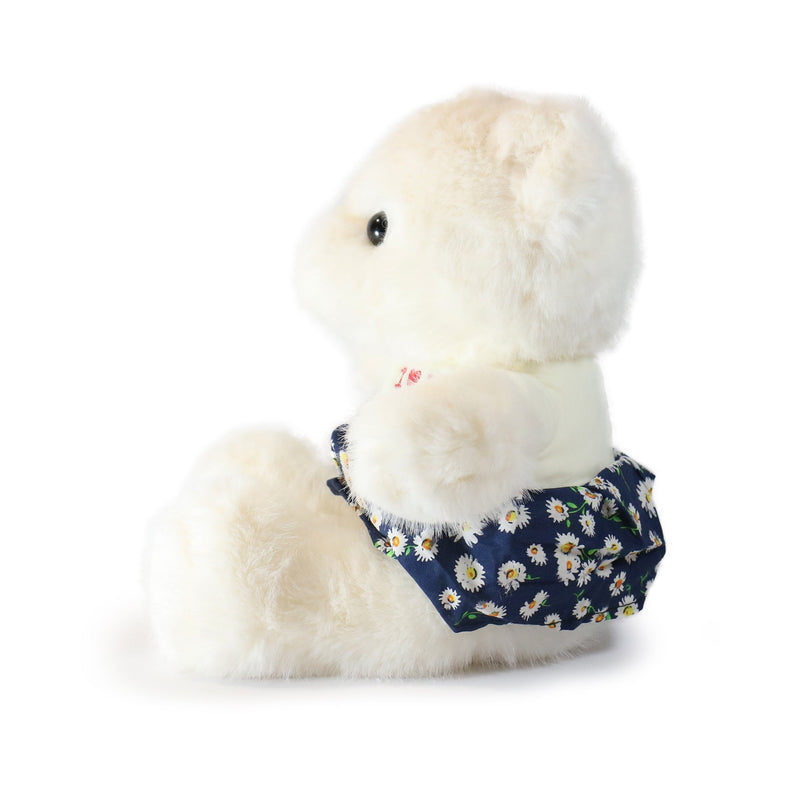 White plush toy with a navy floral-patterned bow tie on a white background