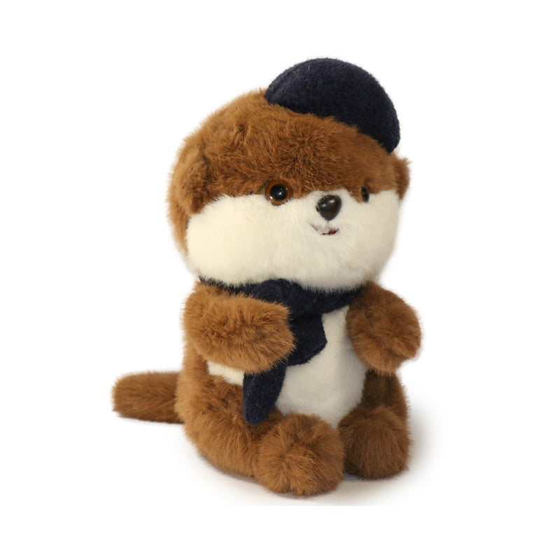 Stuffed animal toy resembling a beaver wearing a black hat and scarf on a white background
