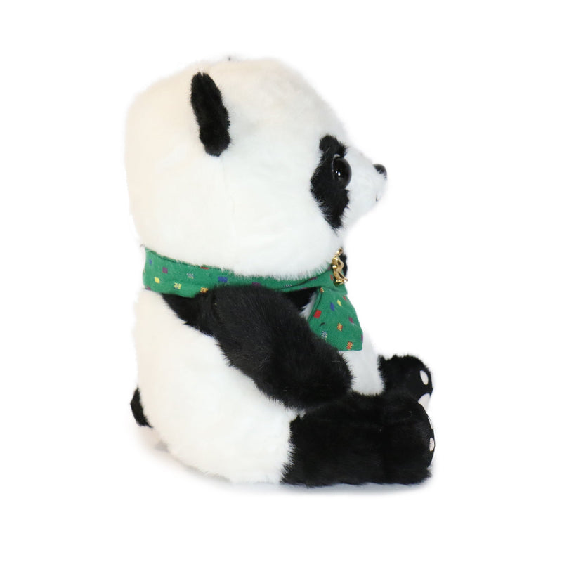 Plush panda bear wearing a green sweater on a white background