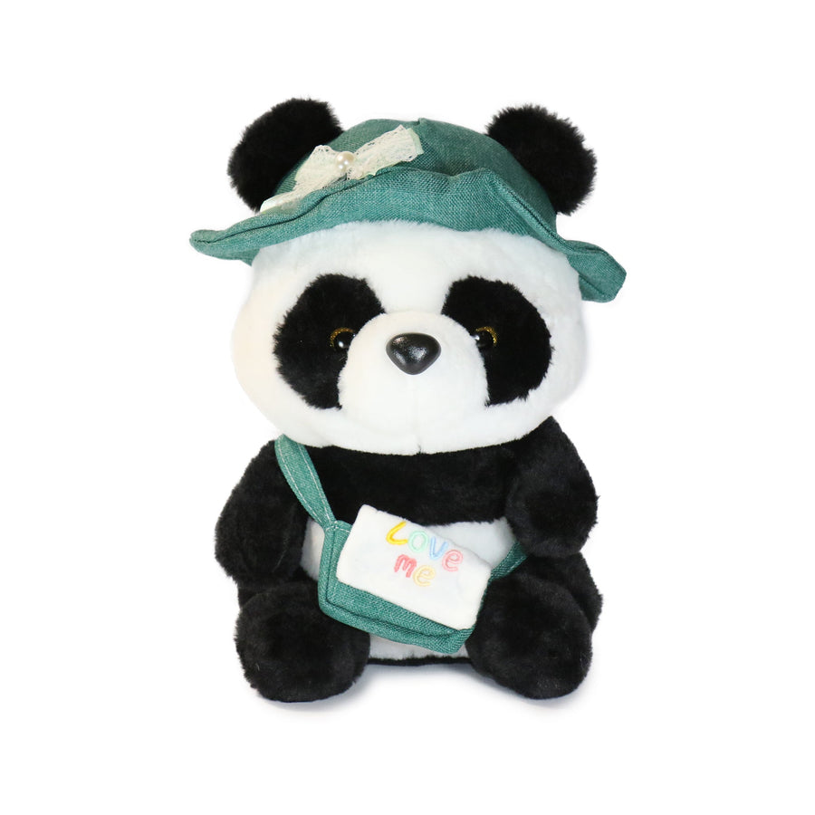 Plush panda toy with a green hat and backpack on a white background
