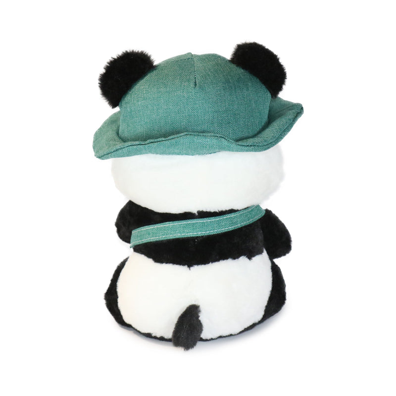 Plush panda toy wearing a green hat on a white background