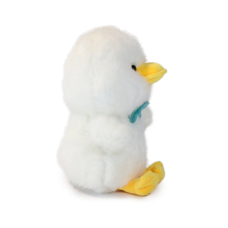 White plush duck with yellow feet and beak on a white background